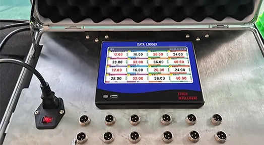 Paperless data logger with 16 active channels Touch-screen paperless data logger displaying 16 live channel values, with 16 M12 sensor connectors on the front panel of a stainless steel case